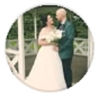 Bride and groom standing by a gazebo Halem