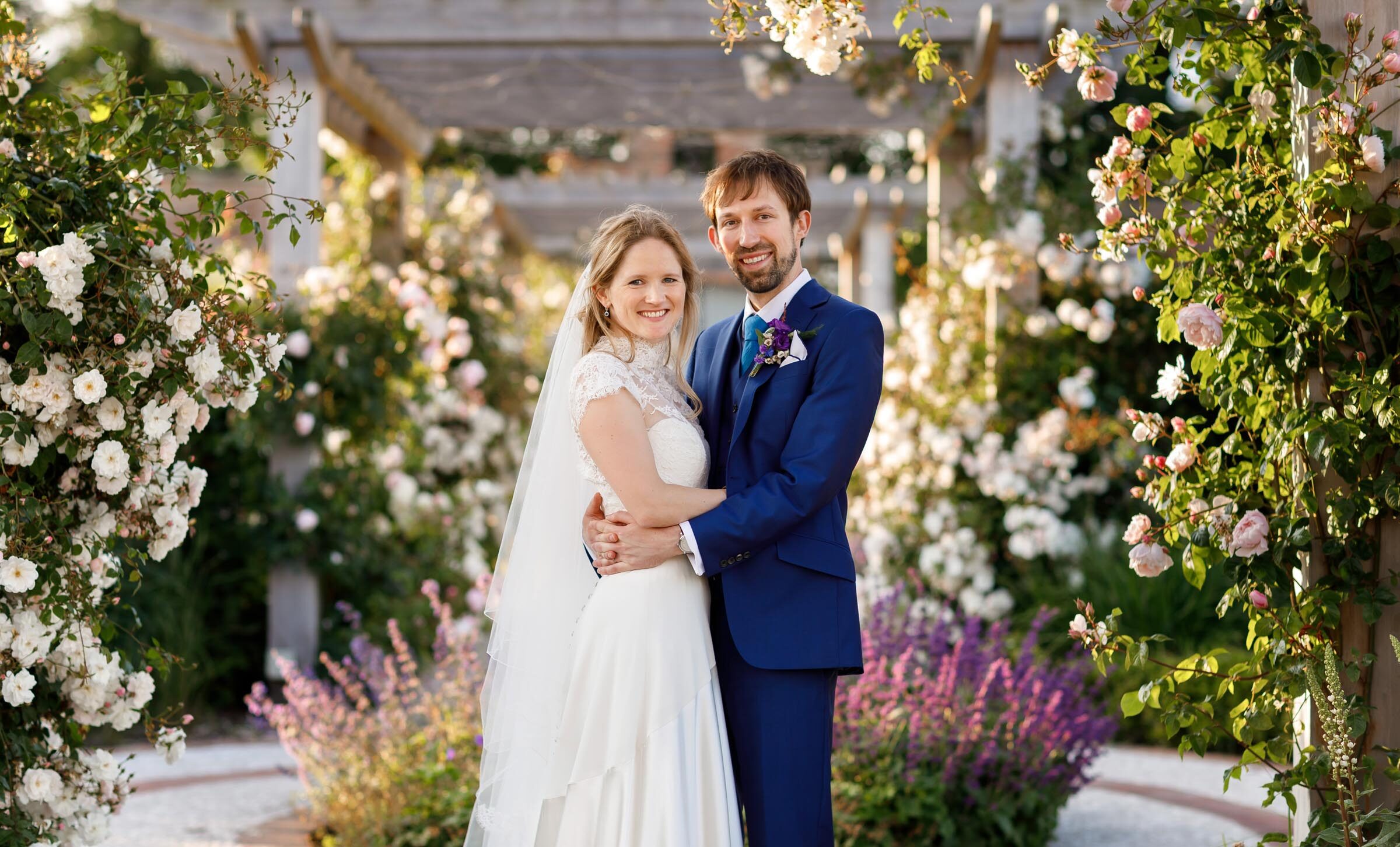 Bride and groom in a rose garden. Halem